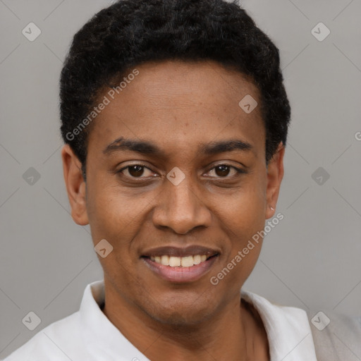 Joyful black young-adult male with short  black hair and brown eyes