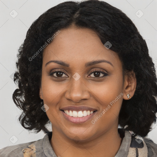 Joyful black young-adult female with long  brown hair and brown eyes