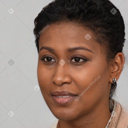 Joyful black young-adult female with short  brown hair and brown eyes