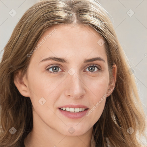 Joyful white young-adult female with long  brown hair and blue eyes