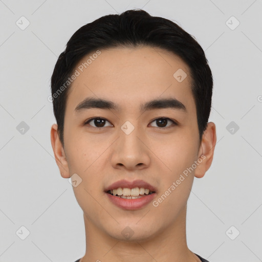 Joyful asian young-adult male with short  black hair and brown eyes