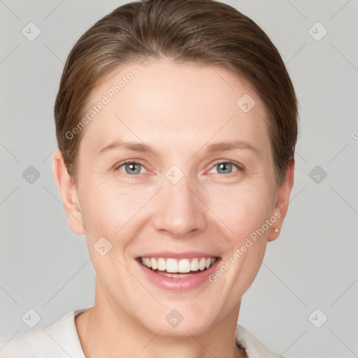 Joyful white young-adult female with short  brown hair and grey eyes