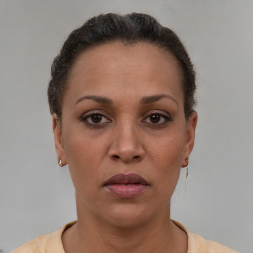Neutral latino adult female with short  brown hair and brown eyes