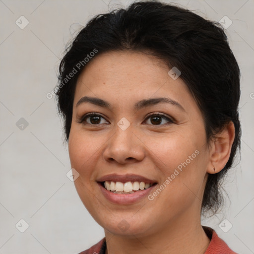 Joyful latino young-adult female with medium  brown hair and brown eyes