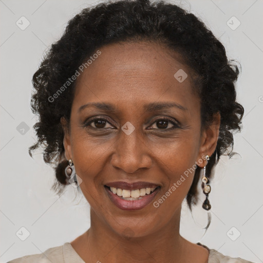 Joyful black adult female with short  brown hair and brown eyes