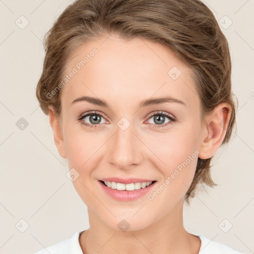 Joyful white young-adult female with medium  brown hair and green eyes