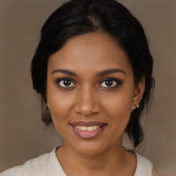 Joyful black young-adult female with medium  brown hair and brown eyes