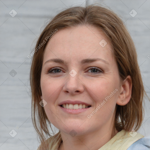 Joyful white young-adult female with medium  brown hair and blue eyes