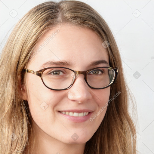 Joyful white young-adult female with long  brown hair and blue eyes