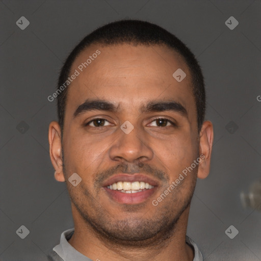 Joyful black young-adult male with short  brown hair and brown eyes