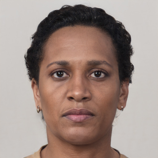 Neutral black young-adult female with short  brown hair and brown eyes