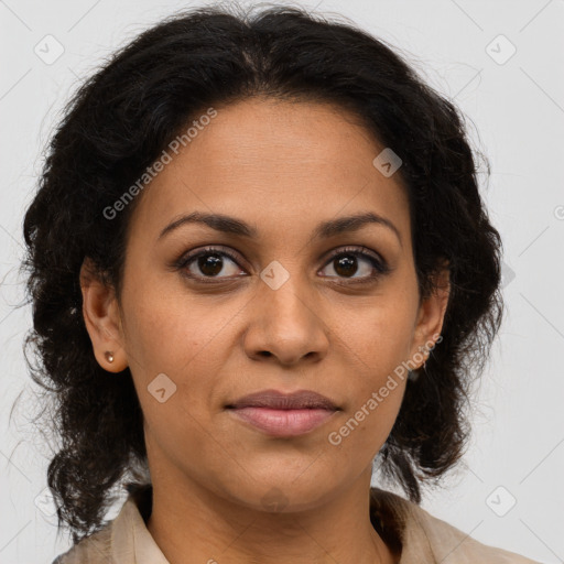 Joyful latino adult female with medium  brown hair and brown eyes