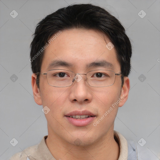 Joyful asian adult male with short  brown hair and brown eyes