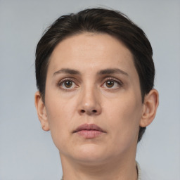 Neutral white young-adult female with short  brown hair and brown eyes