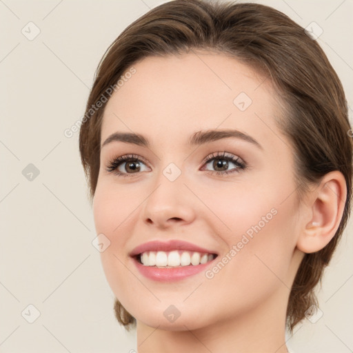 Joyful white young-adult female with long  brown hair and green eyes