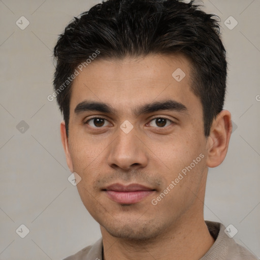 Joyful white young-adult male with short  black hair and brown eyes