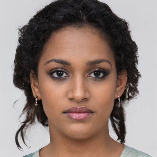 Neutral black young-adult female with medium  brown hair and brown eyes