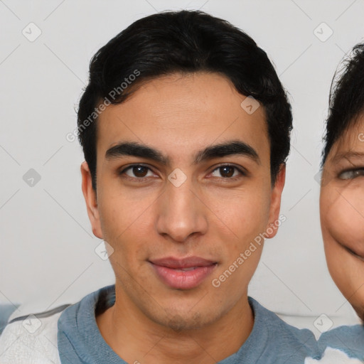 Joyful asian young-adult male with short  black hair and brown eyes