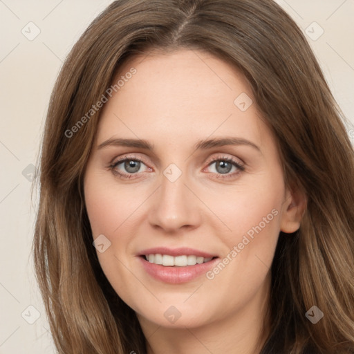 Joyful white young-adult female with long  brown hair and green eyes