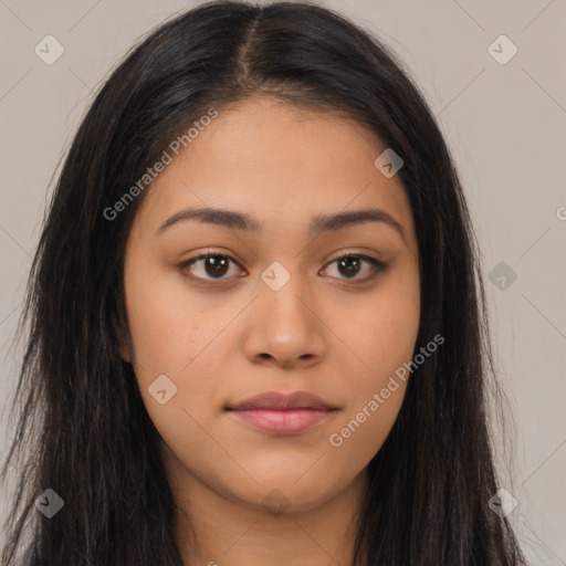 Joyful latino young-adult female with long  brown hair and brown eyes