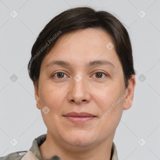 Joyful white adult female with short  brown hair and brown eyes