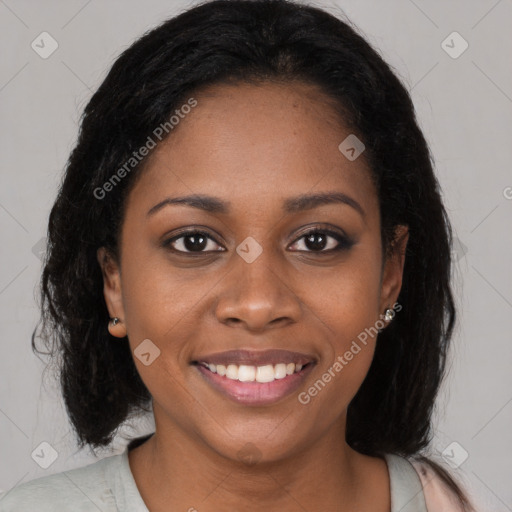 Joyful black young-adult female with medium  brown hair and brown eyes