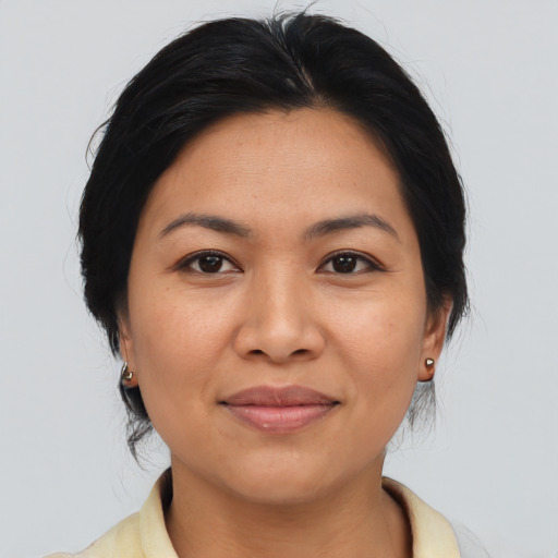 Joyful asian young-adult female with medium  black hair and brown eyes