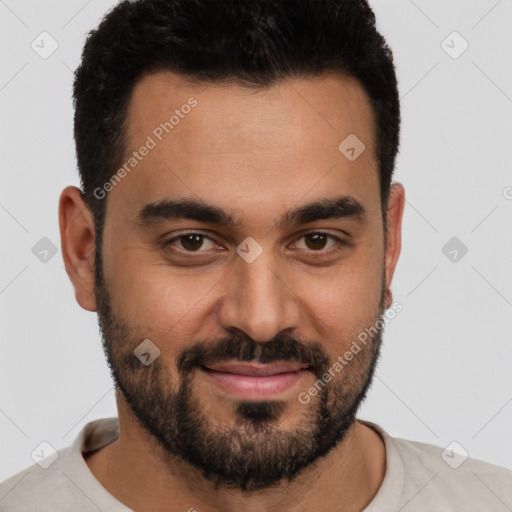 Joyful white young-adult male with short  black hair and brown eyes