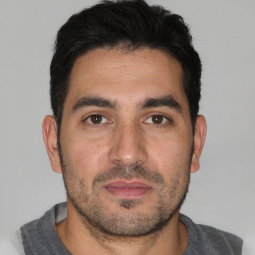 Neutral white young-adult male with short  black hair and brown eyes