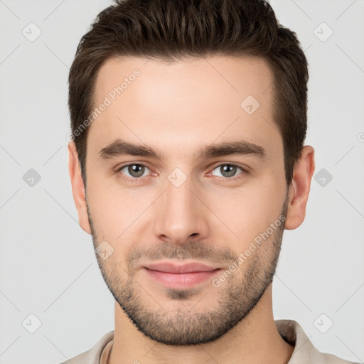 Joyful white young-adult male with short  brown hair and brown eyes