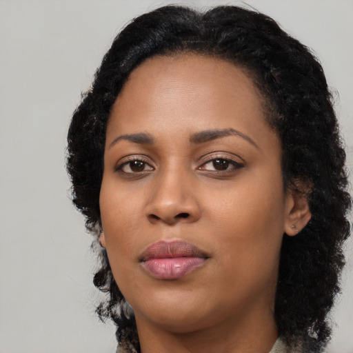 Neutral black young-adult female with long  black hair and brown eyes