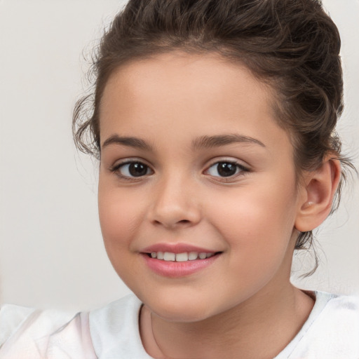 Joyful white child female with medium  brown hair and brown eyes