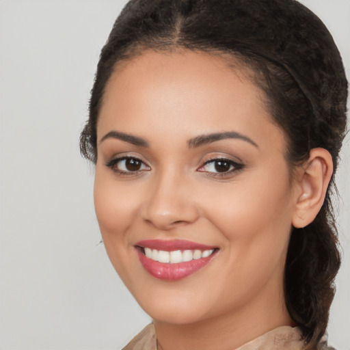 Joyful white young-adult female with medium  brown hair and brown eyes