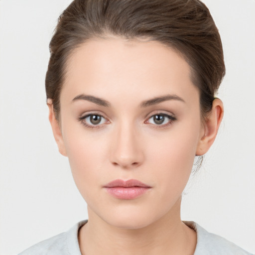 Neutral white young-adult female with medium  brown hair and brown eyes