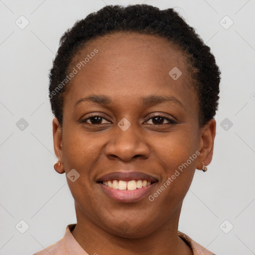 Joyful black young-adult female with short  brown hair and brown eyes