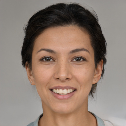 Joyful white young-adult female with medium  brown hair and brown eyes