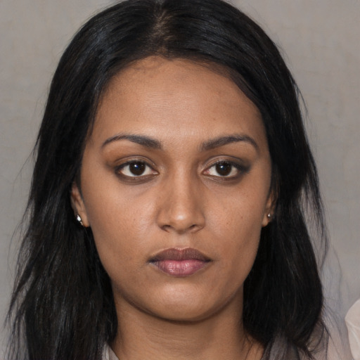 Neutral latino young-adult female with long  black hair and brown eyes