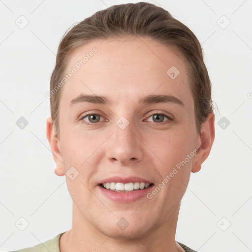 Joyful white young-adult female with short  brown hair and grey eyes