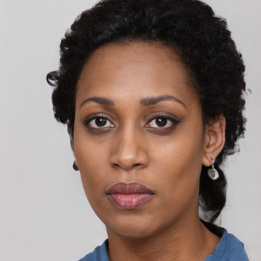 Neutral black young-adult female with short  black hair and brown eyes