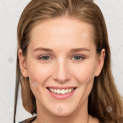 Joyful white young-adult female with long  brown hair and grey eyes