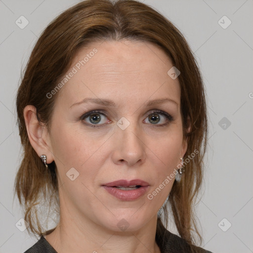 Joyful white adult female with medium  brown hair and grey eyes