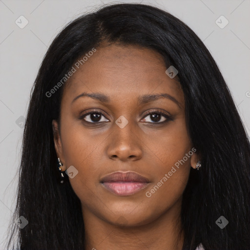 Joyful black young-adult female with long  black hair and brown eyes