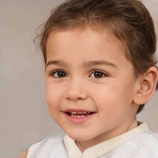 Joyful white child male with short  brown hair and brown eyes