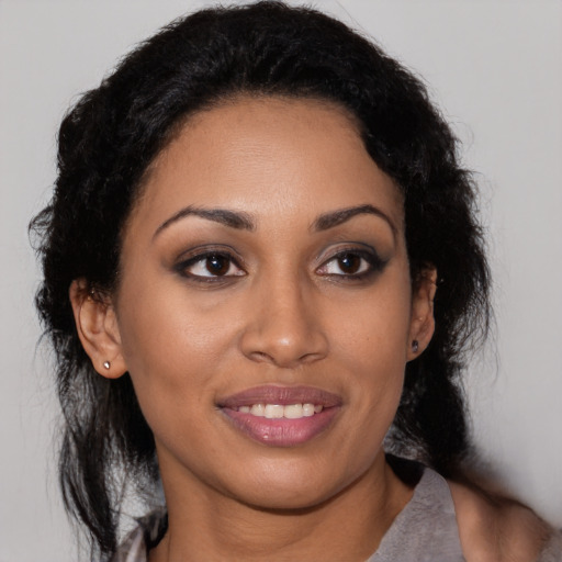 Joyful latino young-adult female with medium  black hair and brown eyes