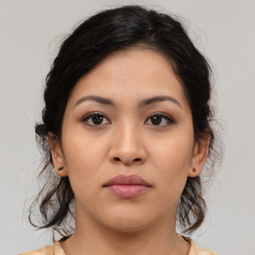Neutral latino young-adult female with medium  brown hair and brown eyes
