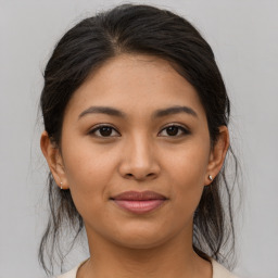 Joyful asian young-adult female with medium  brown hair and brown eyes