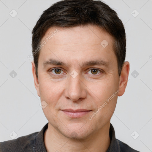 Joyful white adult male with short  brown hair and brown eyes