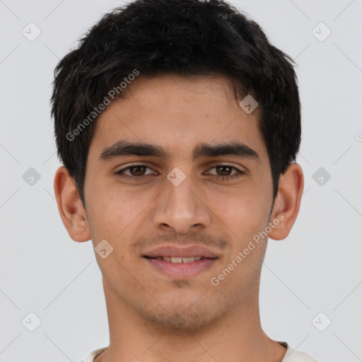 Joyful latino young-adult male with short  brown hair and brown eyes