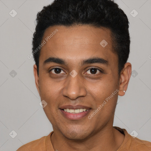 Joyful latino young-adult male with short  black hair and brown eyes