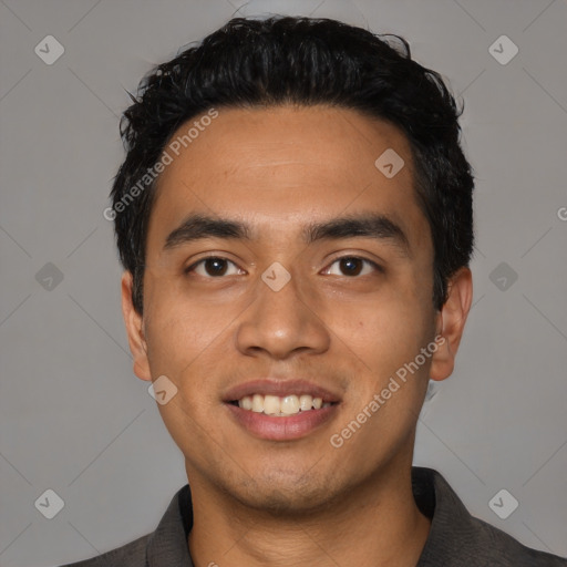 Joyful latino young-adult male with short  black hair and brown eyes